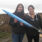 Trish and Nicole holding the rocket.